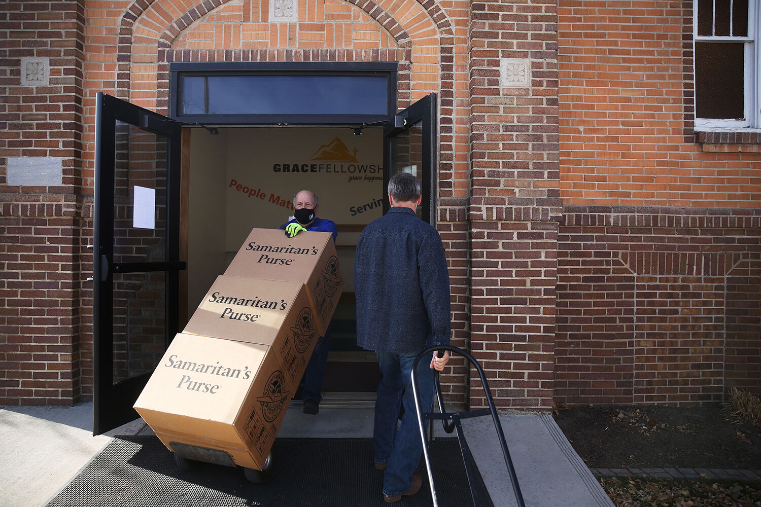 Richard Zander rolls his next load of boxes out the front doors
